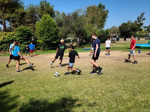 a group of people playing football