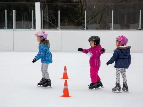 a group of kids on ice skates