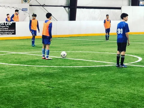 a group of men playing football