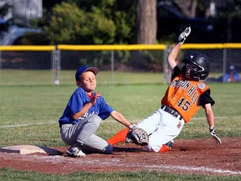 a couple of kids playing baseball