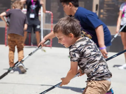 a boy holding a broom