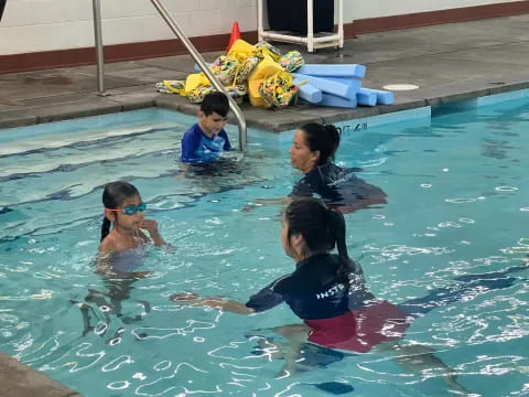 a group of people in a pool