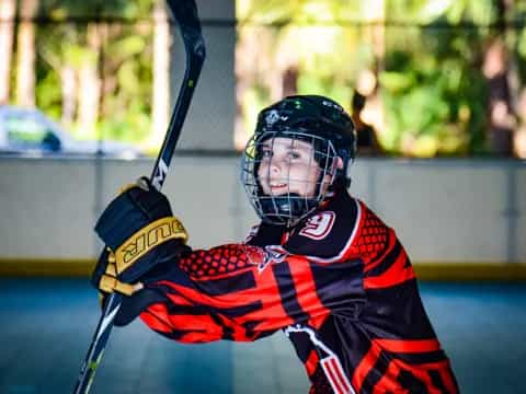 a hockey player holding a hockey stick