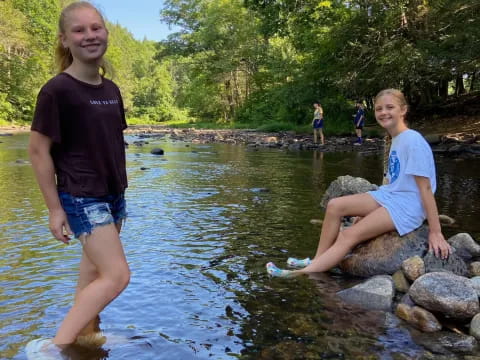 a couple of girls in a river