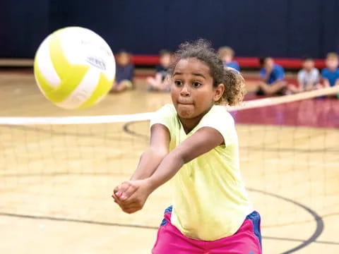 a girl playing volleyball