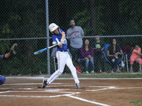 a baseball player swinging a bat