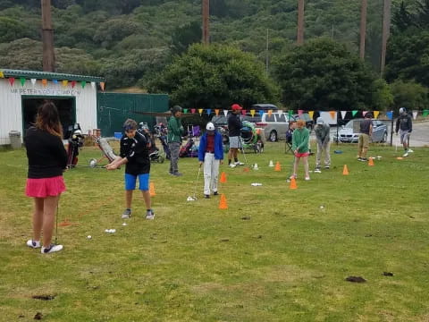 a group of people playing baseball