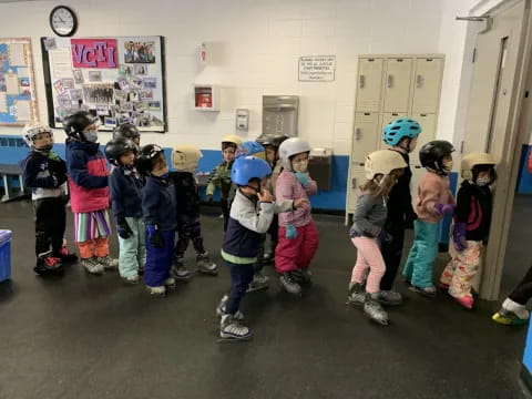 a group of children wearing helmets