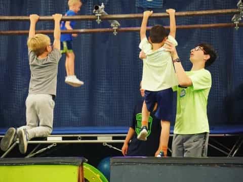 a group of people jumping on a trampoline