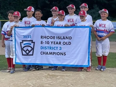 a group of kids holding a banner