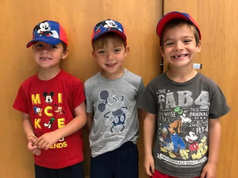 a group of boys wearing matching t-shirts