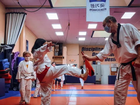 a group of people in karate uniforms