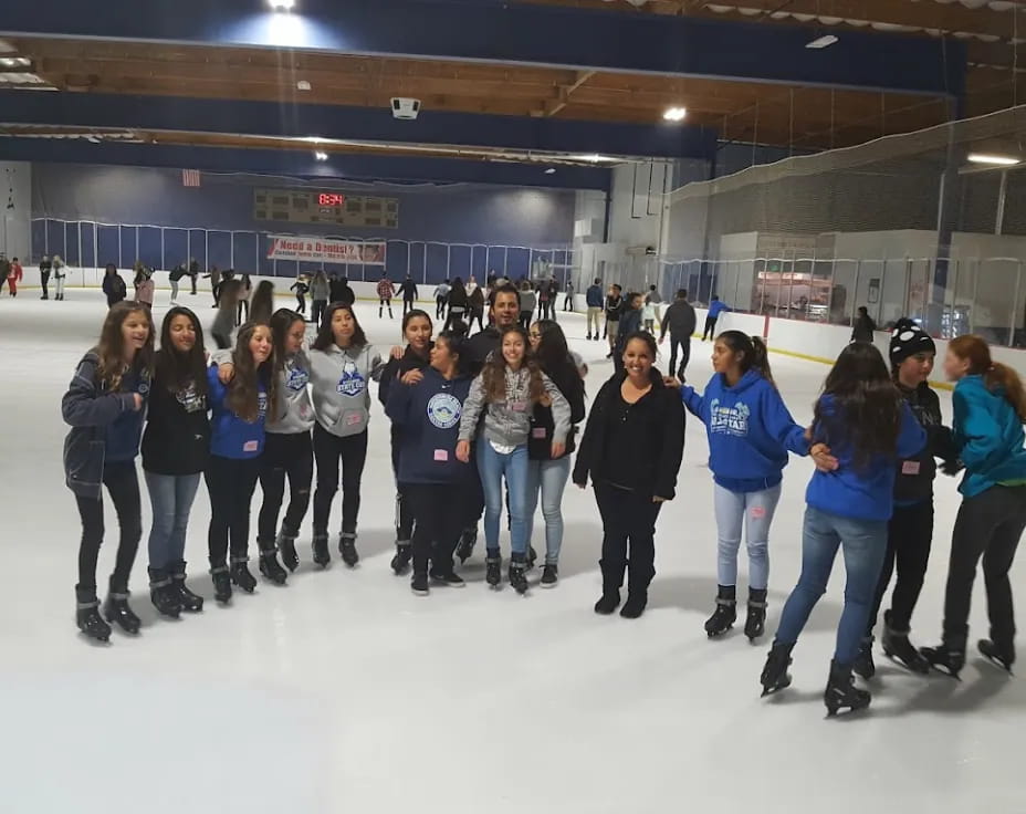 a group of people on an ice rink