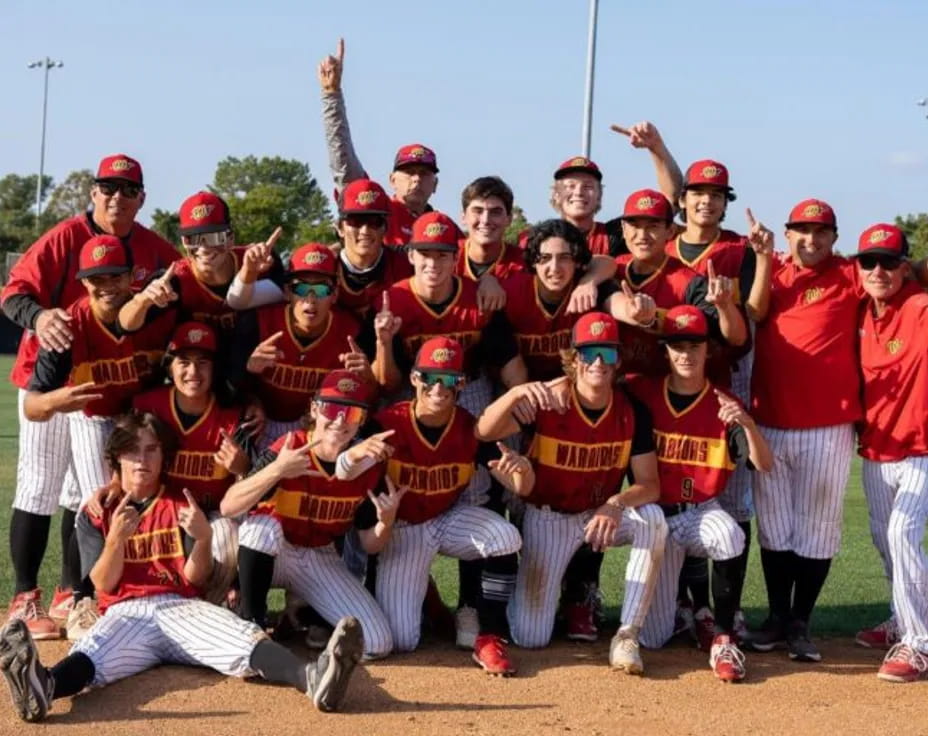 a group of baseball players posing for a photo