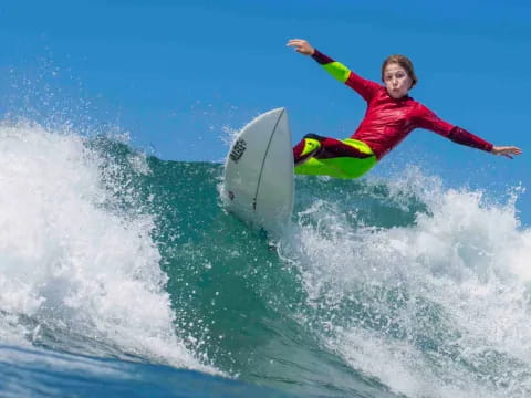 a man surfing on a wave