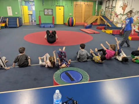 a group of people on a mat