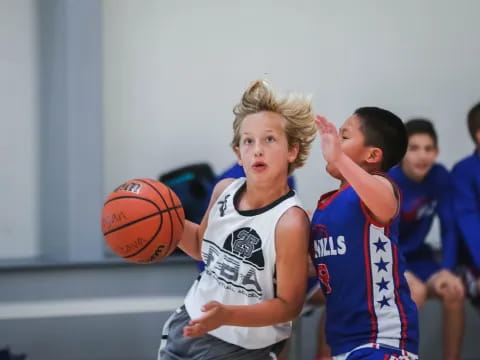 a group of people playing basketball