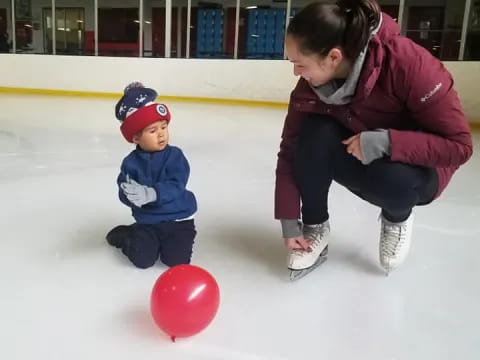 a person and a child on ice