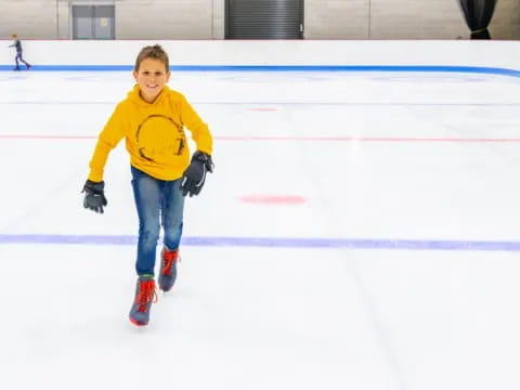 a boy on an ice rink