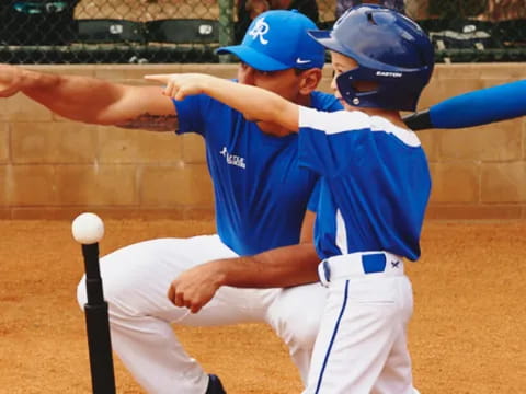 a baseball player hitting a ball with his bat