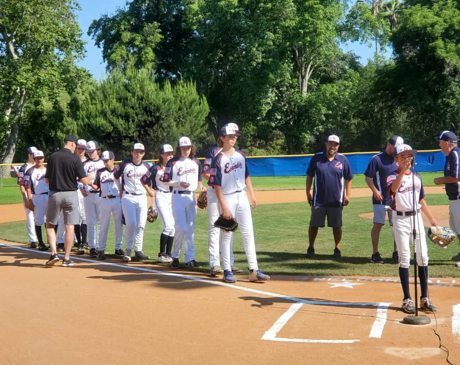 a group of baseball players standing on a field