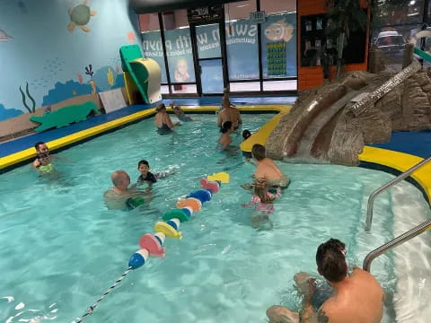 a group of people in a pool