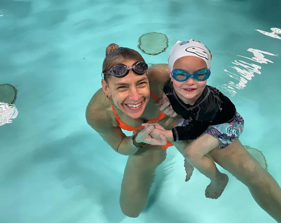 a person and a boy in the water