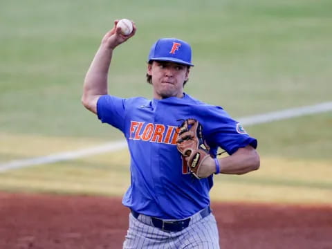 a baseball player throwing a ball