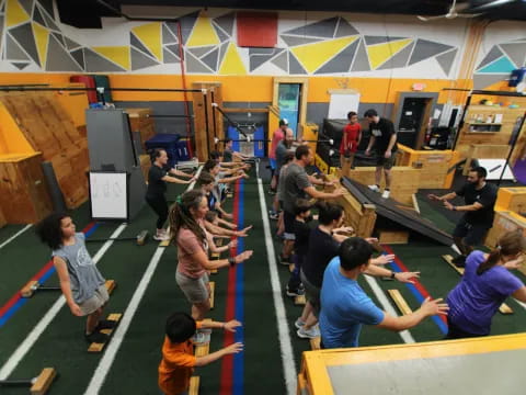 a group of people in a gym