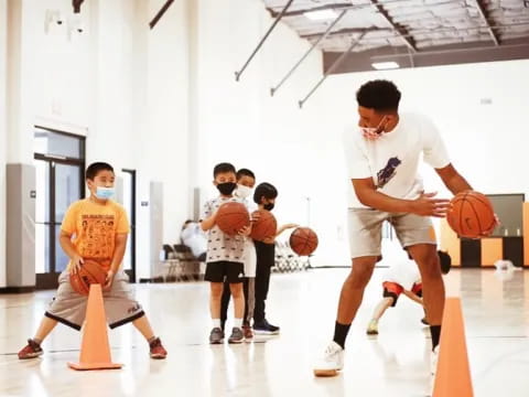 a group of people playing basketball