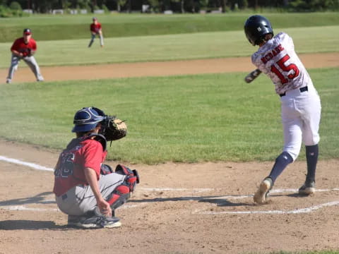 a baseball player swinging a bat