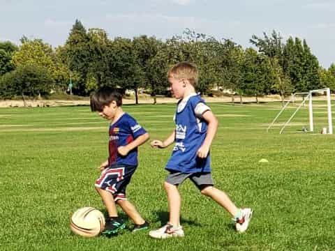 a couple of boys playing football
