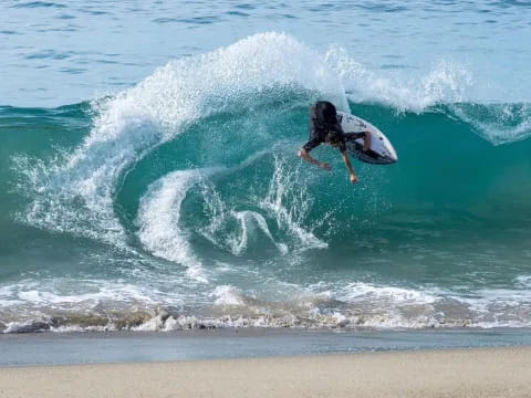 a person surfing on the waves