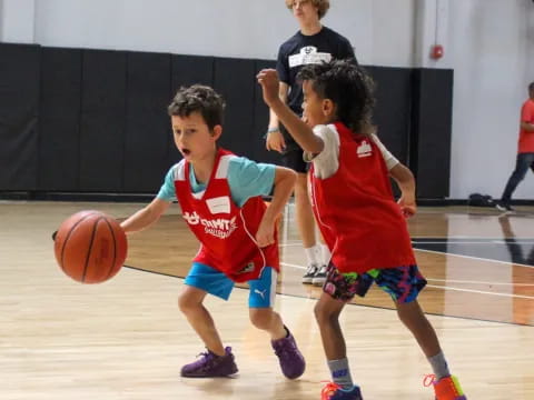 a group of kids playing basketball