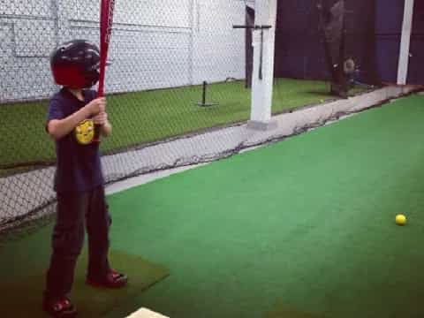 a kid holding a baseball bat