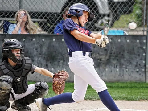 a baseball player swinging a bat