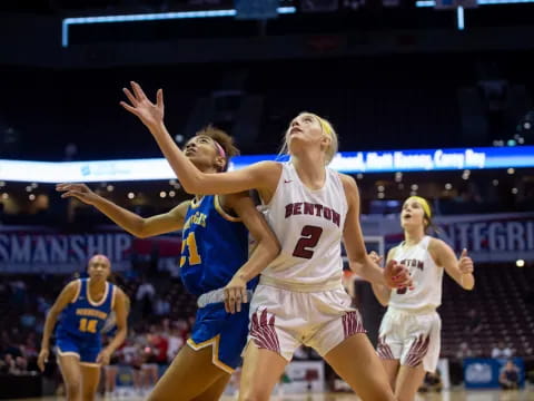 a group of women playing basketball