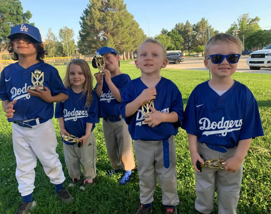 a group of kids in blue shirts