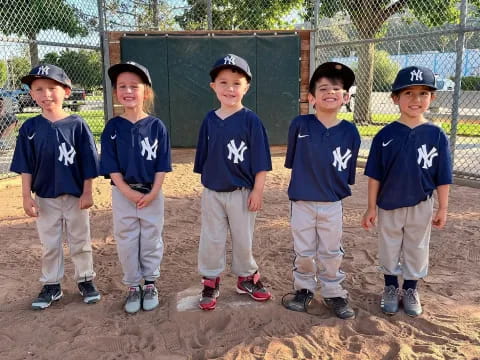 a group of kids in blue shirts