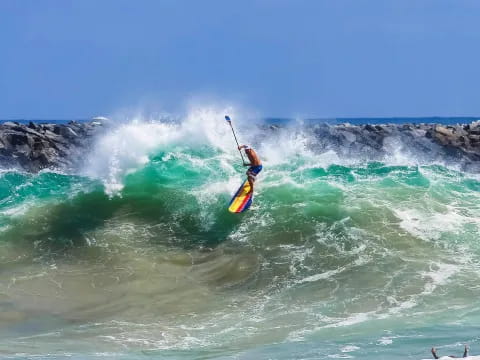 a person surfing on a wave