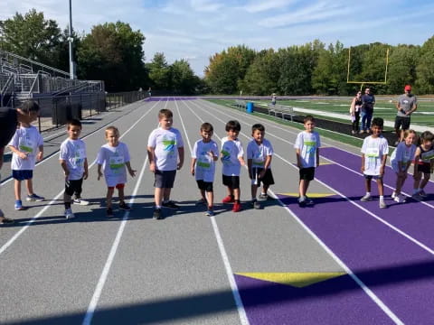 a group of people running on a track