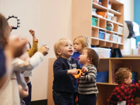 a group of children playing with toys