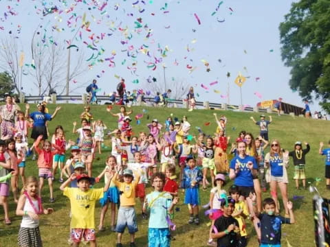 a group of people flying kites