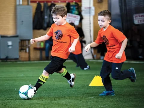 kids playing football on a field