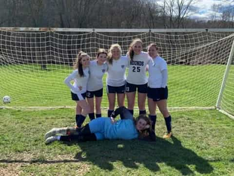 a group of girls playing football