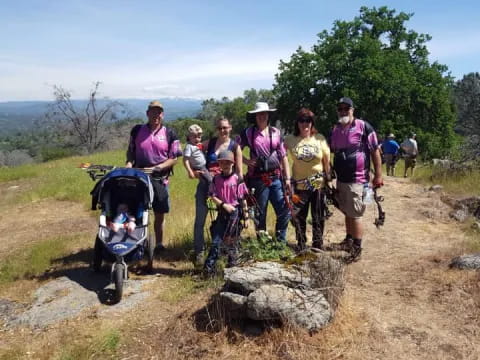 a group of people walking on a trail