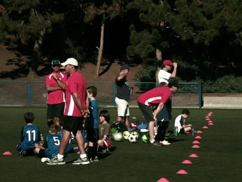 a group of people playing football