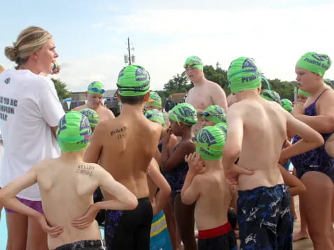 a group of people wearing swim caps