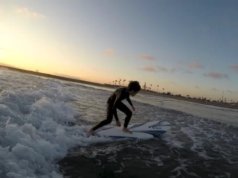 a man riding a surfboard