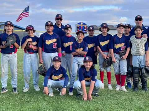 a group of baseball players posing for a photo